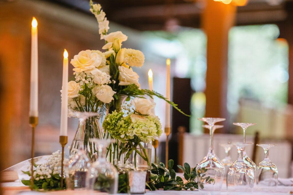 A photograph of flowers on a table.