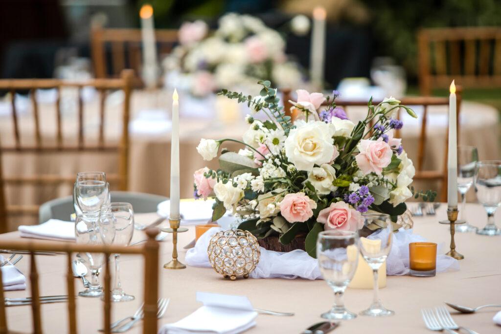 A photograph of flowers on a table.